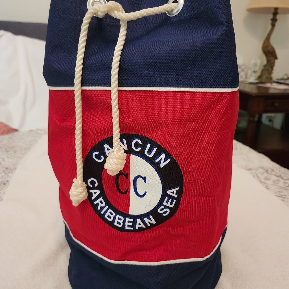 Stylish Artex vertical travel duffel bag in Cancun colors red & blue with straps